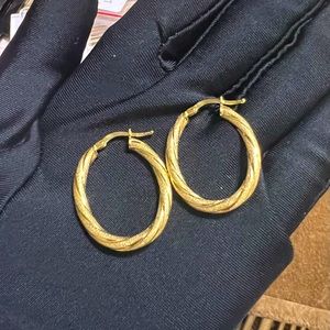 Brand new 18K Saudi gold loop earrings